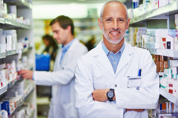 Your wellness is my main priority. Portrait of a confident mature pharmacist working in a pharmacy. - Photo, Image