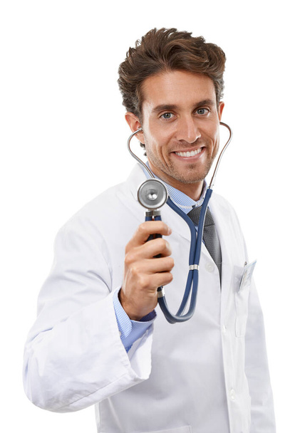 Take a deep breath. Studio portrait of a young doctor holding up his stethoscope to the camera. - Foto, Imagem