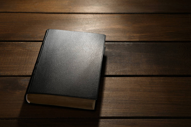 Bible on wooden table, space for text. Christian religious book - Photo, image