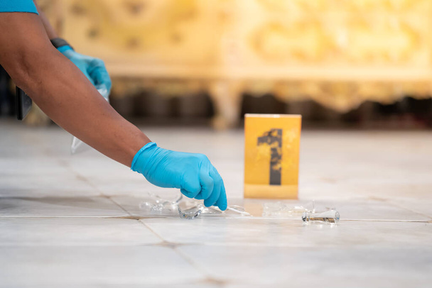 Forensic Scientist's Blue Gloves At the murder scene to collect evidence.soft focus.shallow focus effect. - Photo, Image