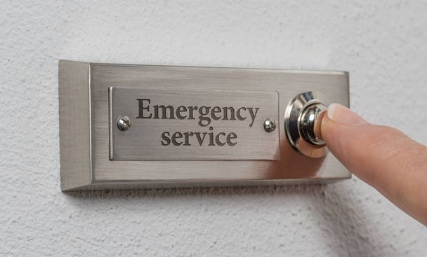 Doorbell sign with the engraving Emergency service - Photo, Image
