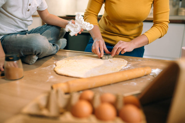 mother and son preparing food in kitchen - Foto, Bild