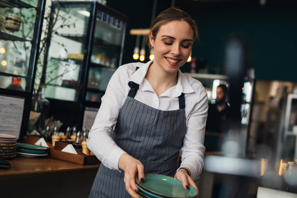 waitress working in restaurant or cafe - Foto, immagini