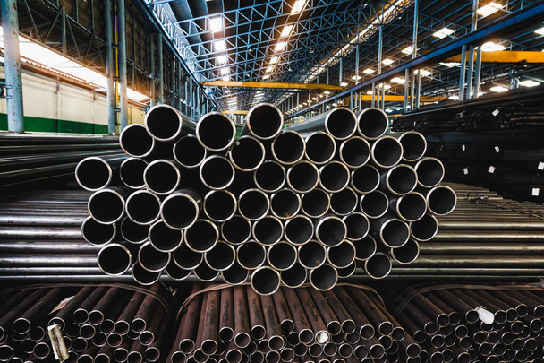 high quality Galvanized steel pipe or Aluminum and chrome stainless pipes in stack waiting for shipment  in warehouse - Photo, Image