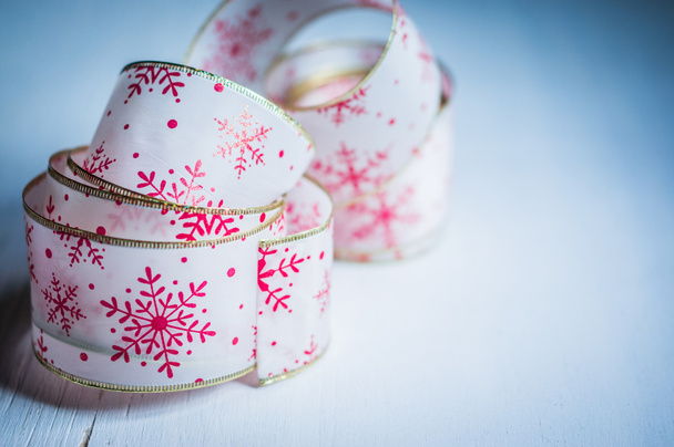 Holiday ribbon on wooden background - Photo, Image