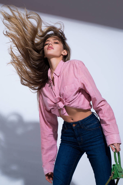 Fashion woman in vogue dress, fashion luxury modern style model. Fashion woman in pink shirt and jeans. - Valokuva, kuva