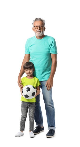 Little boy and his grandfather with ball on white background - Φωτογραφία, εικόνα