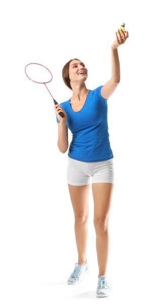 Sportieve vrouwelijke badminton speler op witte achtergrond - Foto, afbeelding