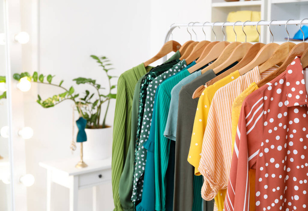 Rack with modern clothes in shop - Foto, Bild