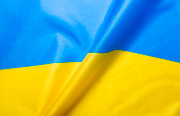 Flag of Ukraine. Blue and yellow colors. Close up shot, background - Photo, image