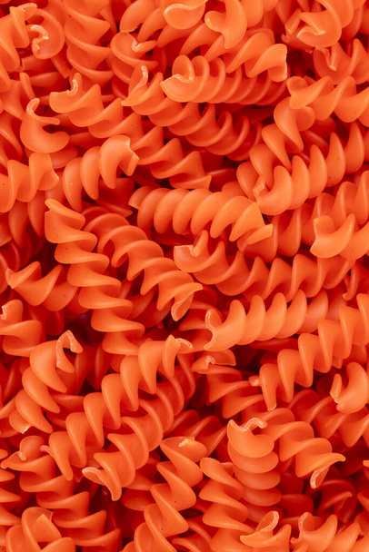 Whole, lentils fusilli pasta background. - Zdjęcie, obraz