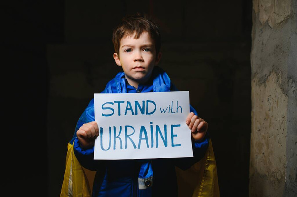 Kids with poster with banner of russia conflict, military protest. Child with message Stop War. America stand with Ukraine. - Photo, Image