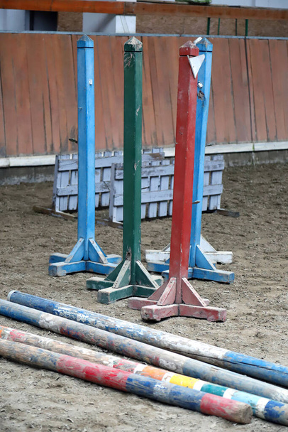 Show jumping poles obstacles, barriers, waiting for riders on show jumping training. Horse obstacle course outdoors summertime - Photo, Image
