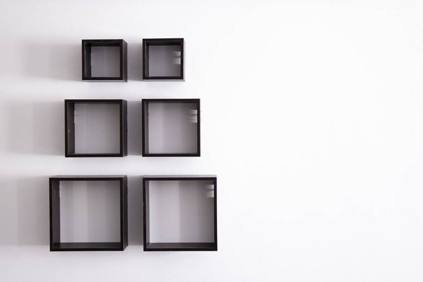 designer shelves on a white wall in an apartment.Design concept - Foto, Imagen