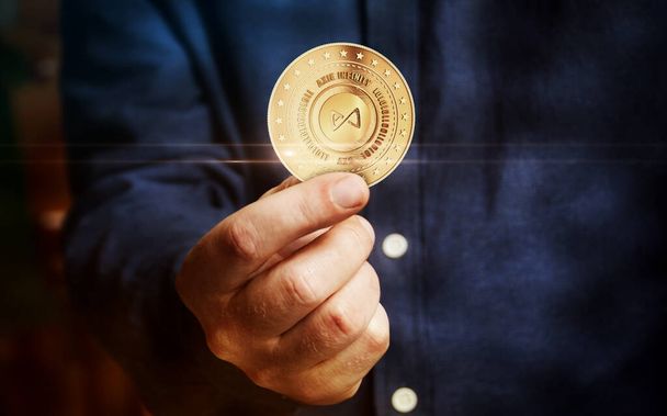 Axie AXS infinity, game cryptocurrency symbol golden coin in hand abstract concept.` - Photo, Image