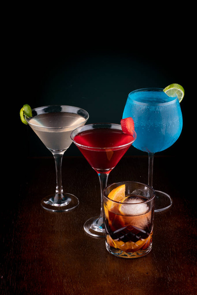 collection of drinks and cocktails in dark background  - Photo, Image