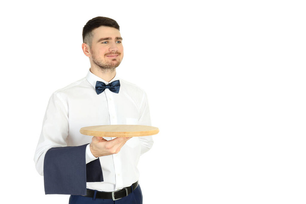 Νεαρός σερβιτόρος απομονωμένος σε λευκό φόντο - Φωτογραφία, εικόνα
