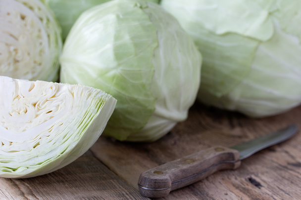 Cabbage on wooden background - Фото, зображення
