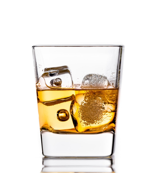 scotch whiskey in glass with ice cubes on white - Foto, Imagem