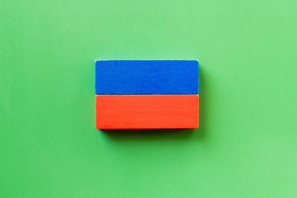 top view of blue and red rectangular blocks on green background - Photo, Image