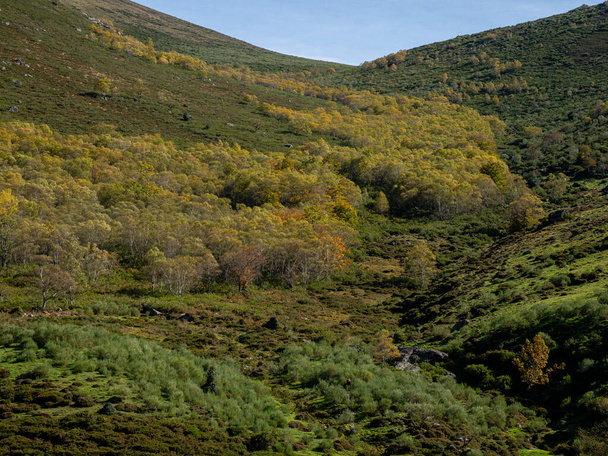 collado de Sejos, senderistas pasando junto a los molinos del diablo, , barranco del Diablo, parque natural del Saja-Besaya, Cantabria, Spain - Photo, Image