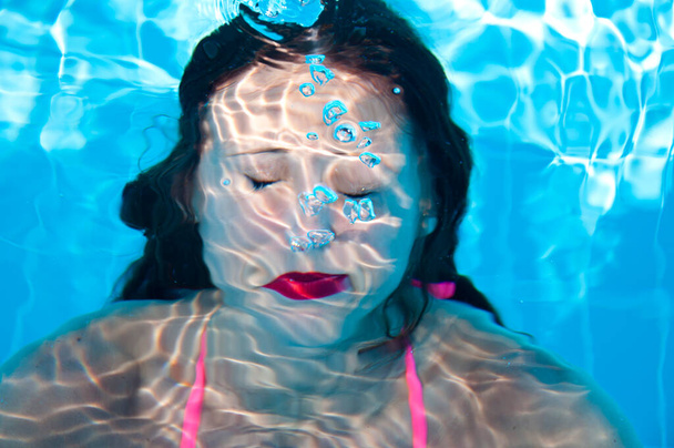 funny woman swimmer under sea water. summer vacation. underwater. - Foto, afbeelding
