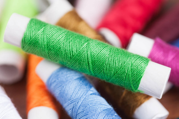 colorful sewing threads, closeup - Foto, afbeelding