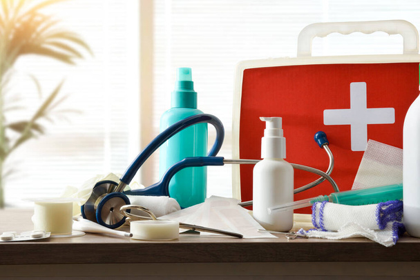 Hospital  assortment of basic first aid portable medical assistance equipment on white table. Horizontal composition. Front view.  - Fotoğraf, Görsel