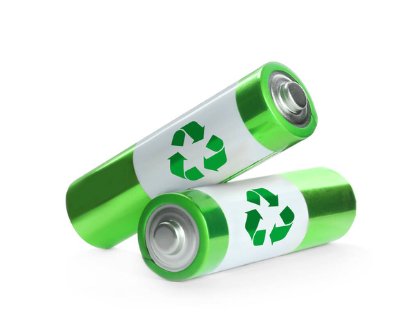 Batteries with recycle symbols on white background - Фото, изображение