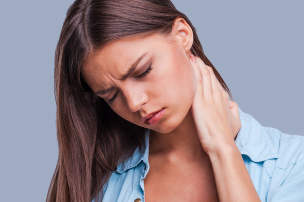 Woman with neck pain. - Zdjęcie, obraz