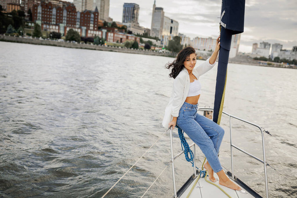Bachelorette party on a yacht, a beautiful girl on a walk along the river. setting sun - Valokuva, kuva