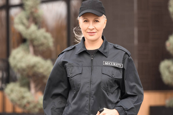 Female security guard outdoors - Фото, изображение