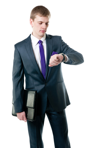 The young businessman in a suit looking at the watch - Фото, зображення