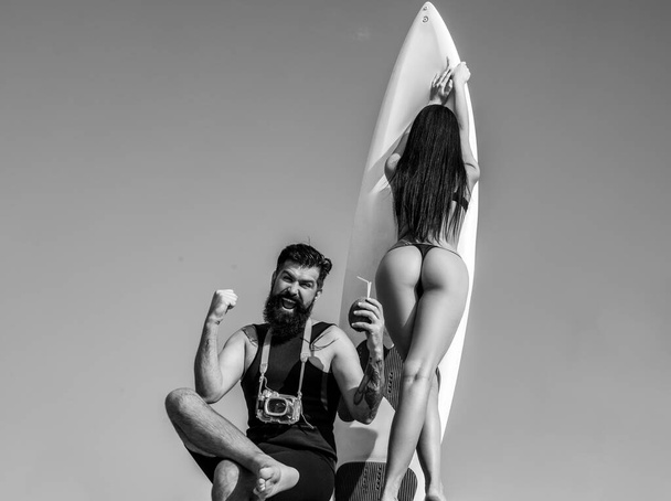 Summer couple vacation. Sexy woman in bikini. Summertime concept. Sexy man in swimsuit. Surfboard. Life Winner. - Foto, immagini