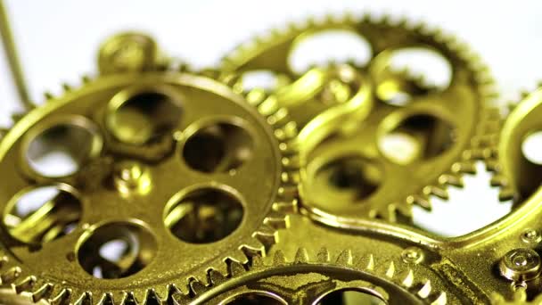 Machine de mécanisme de roue d'engrenage métallique doré fonctionnant - Séquence, vidéo