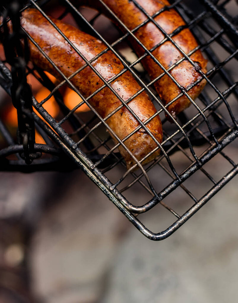 Grilled sausages over the fire. - Foto, immagini