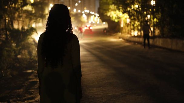 silhouette of a Female on the road - Photo, Image