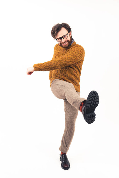 Bearded Caucasian man dancing and smiling casual clothes full shot isolated white background studio shot  - Photo, Image
