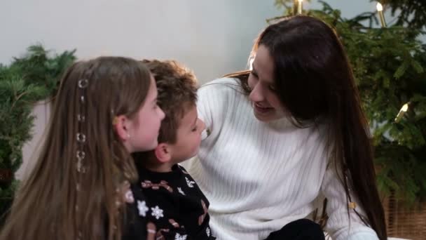 Beautiful mother shows her love for her children. Family, love and people concept - Footage, Video