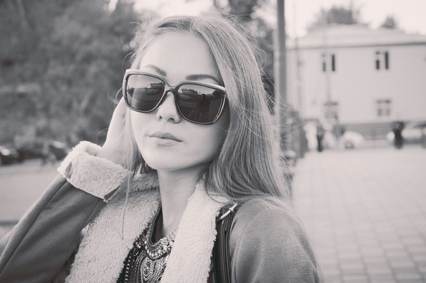 Women in sunglasses street closeup image. BW or sepia film style instagram colors - Fotografie, Obrázek