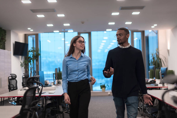 Two happy diverse professional executive business team people woman and African American man walking in coworking office. Multicultural company managers team portrait. - Foto, imagen