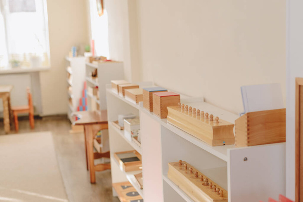 wooden shelf with materials for Montessori studies. study of mathematics. - Valokuva, kuva