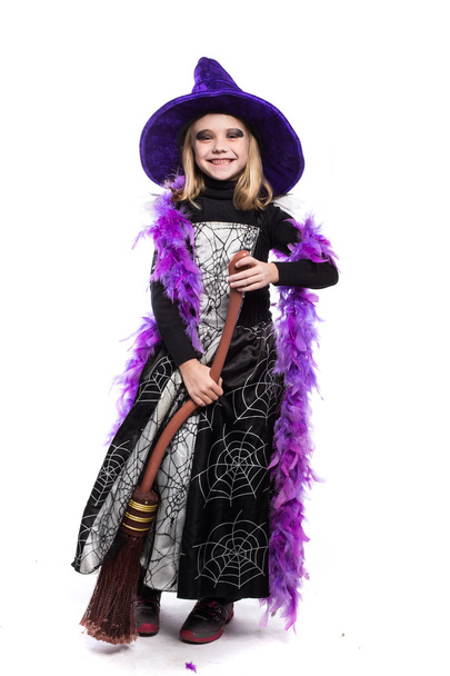 Cute little Halloween witch with broom - Foto, imagen