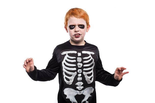 Adorable red hair boy disguised in halloween - 写真・画像