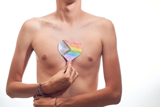 Body of person with LGBT heart, new pride flag. - Foto, Imagen