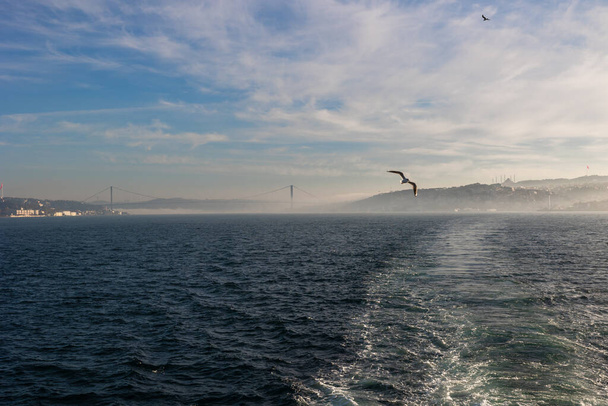 Istanbul morning. Istanbul view from a vessel in morning at foggy weather. Travel to Turkey concept. - Foto, afbeelding
