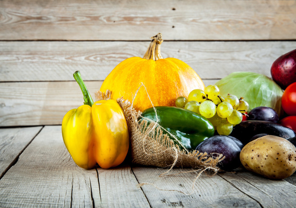 Fruits and vegetables with pumpkins in autumn vintage still life - Foto, imagen
