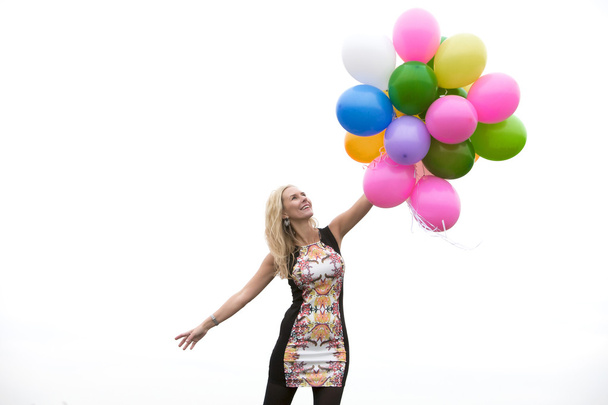 Mujer con globos
 - Foto, Imagen
