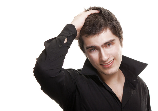 Young man in black shirt smiling isolated on white background - Фото, зображення