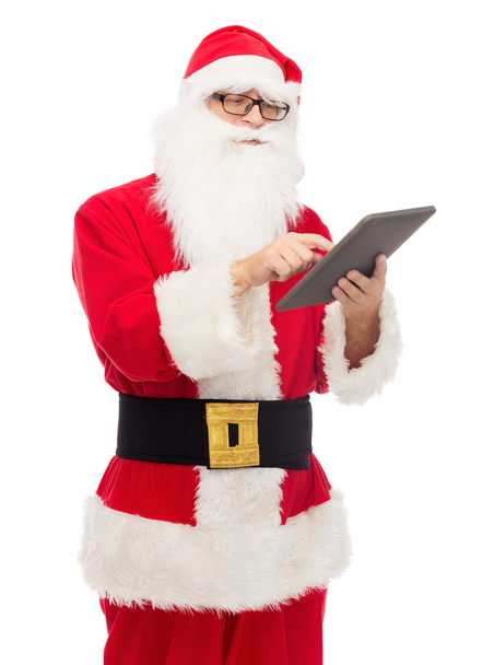 man in costume of santa claus with tablet pc - Foto, afbeelding